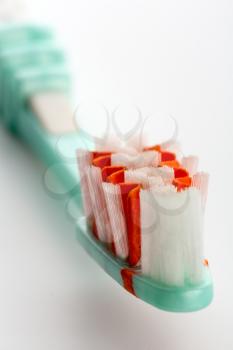 A closeup of toothbrush on white background