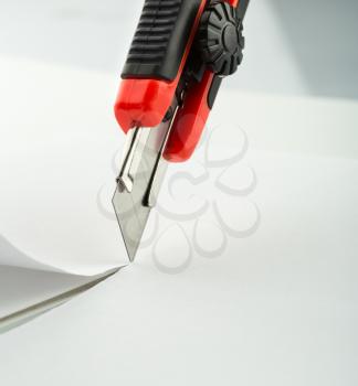 Red office knife isolated on white background