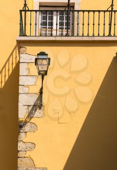 Lantern on yellow european house close up, Portugal