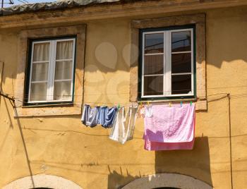 Colorful clothing is drying in sun
