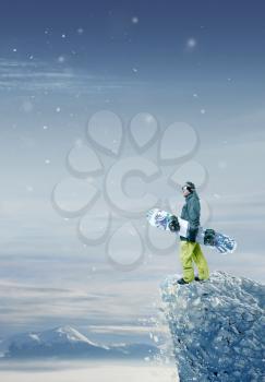Snowboarder standing and looking forward
