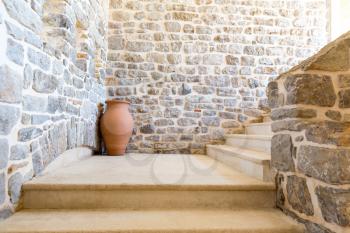 Old stone stairs and pot