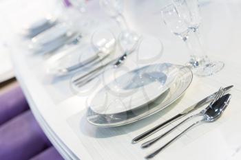 Served with a kitchen tools on the table in white and purple colors