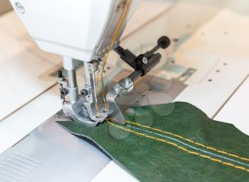 Sewing process in the phase of overstitching closeup picture