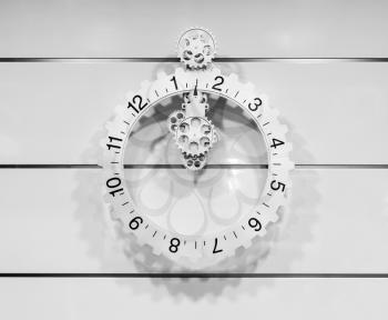 Classic clock on the white wall with moving pointer