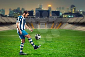 Football player training on the football ground