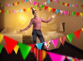 Happy birthday boy standing in decorated room