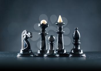 Black chess figures on the table