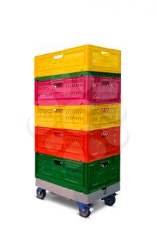 Pile of multicolored plastic boxes on the shelf with wheels