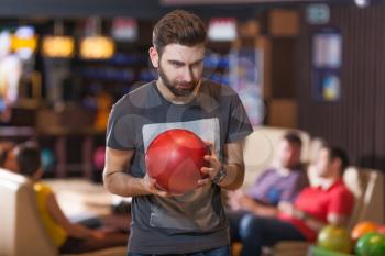 Portrait of a bearded man with bowling ball