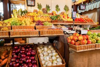 Counters with fresh fruits and vegetables. Greengrocery on the background. Organic food.