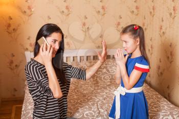 Mother asks the daughter to keep silent so far she speaks by phone