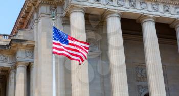Washington DC Monuments with USA. Flag waving on window
