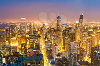 Aerial view of downtown towers at the night from high above, Chicago, Illinois USA.