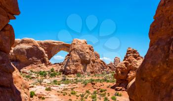 Arch between rocky mountains at the Arches National Park.