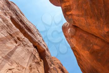 Bottom of a desert canyon with blue sky.