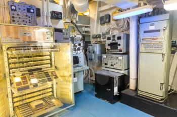 Military ship electric room with gauge, switches, indications and control panel.
