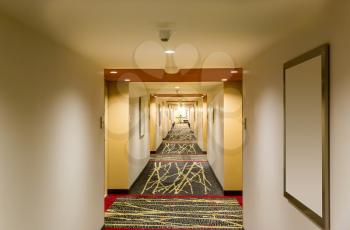 Hotel corridor interior with carpet. Empty hotel hallway.