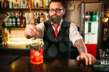 Attractive alcoholic drink preparation show. Professional bartending