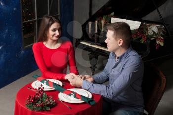 Man confesses his love for a beautiful woman in luxury vintage restaurant