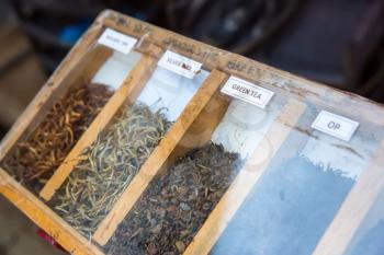 Collection of fresh Ceylon teas in boxes, closeup view. Aromatic harvest of Sri Lanka