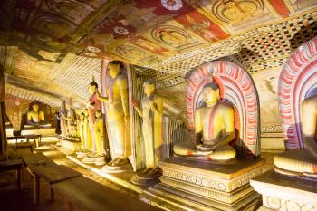 Ancient golden statues in buddha temple on Ceylon. Sri Lanka, Unesco heritage. Asia culture, bubbhism religion