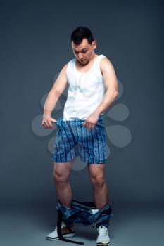 Man with pants down looking at his penis. Prostate or potency problem concept