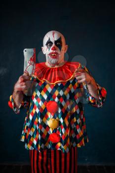 Mad bloody clown with meat cleaver and baseball bat, circus horror. Man with makeup in carnival costume, crazy maniac