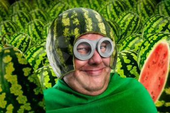 Crazy man in watermelon helmet and googles, parasitic caterpillar or worm, fruit instead of head