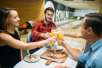 Bowling team celebrate the victory in the competition. Friends relax after playing tenpin game in club, active leisure, healthy lifestyle