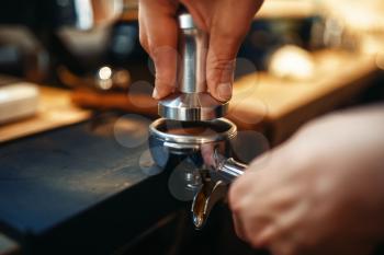 Male barista hands, fresh black coffee preparation at cafe counter. Barman works in cafeteria, bartender prepares espresso