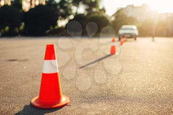 Cones for the examination, driving school concept. lesson for novice car drivers, test for beginner