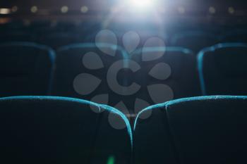 Empty rows of seats in cinema or theater, nobody, no people. Showtime, entertainment industry