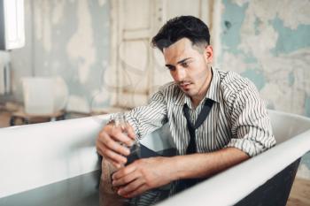 Drunk businessman in bathtub, suicide man concept. Problem in business, stress