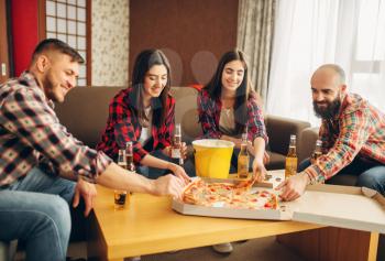Smiling friends drinks beer with pizza at the house party. Good friendship, group of people leisures together. Cheerful company having fun
