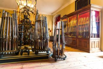 Museum with old weapons, ancient armory storage, Europe. Medieval european guns, famous places for travel and tourism