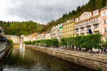 City river and stone pedestrian bridge, Karlovy Vary, Czech Republic, Europe. Old european town, famous place for travel and tourism