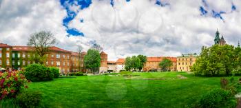 Grass lawn in Wawel castle, panoramic view, Krakow, Poland. European town with ancient architecture buildings, famous place for travel and tourism