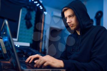 Programmer working on laptop, computer technology. IT-manager at his workplace, professional coding and encryption, network security