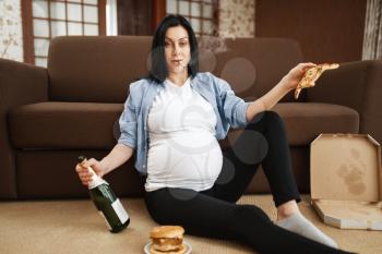 Pregnant woman with belly smoking and drinks alcohol at home. Pregnancy and bad habits, unhealthy lifestyle in prenatal period. Ugly expectant mom, health damage