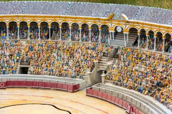 People on tribunes of the famous arena, miniature scene outdoor, europe. Mini figures with high detaling of objects