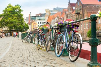 Bicycles and ancient building facade, old European town. Summer tourism and travels, famous europe landmark