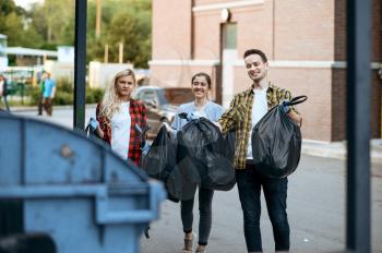 Volunteers holds plastic trash bags outdoors, volunteering. People cleans city streets, ecological restoration, eco lifestyle, garbage collection and recycling, ecology care, environment cleaning