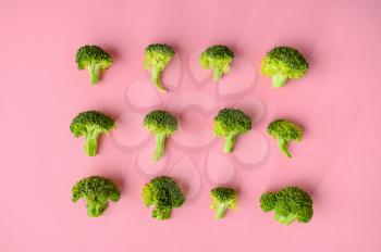 Fresh broccoli isolated on pink background, top view. Organic vegetarian food, grocery assortment, natural eco products, healthy lifestyle concept