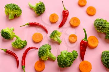 Fresh broccoli, pepper and carrot isolated on pink background, top view. Organic vegetarian food, grocery vegan assortment, natural eco products, healthy lifestyle concept