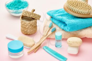 Oral and skin care products, macro view, pink background, nobody. Morning healthcare and toothcare procedures concept, hygiene tools