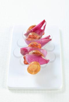 Bacon and potato skewer with Spanish onion 