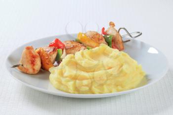 Chicken skewer served with mashed potato
