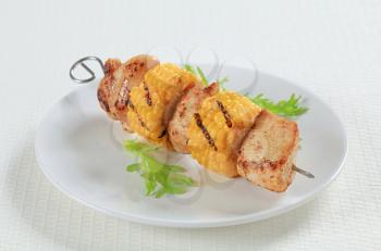 Grilled chicken and sweet corn on skewer 