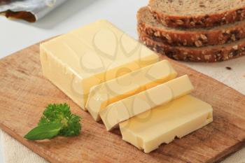 Block of fresh butter and brown bread